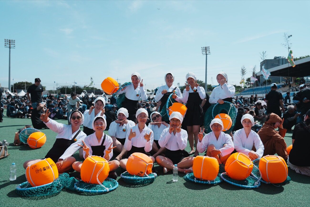 Jeju haenyeo gathered together with their traditional floats